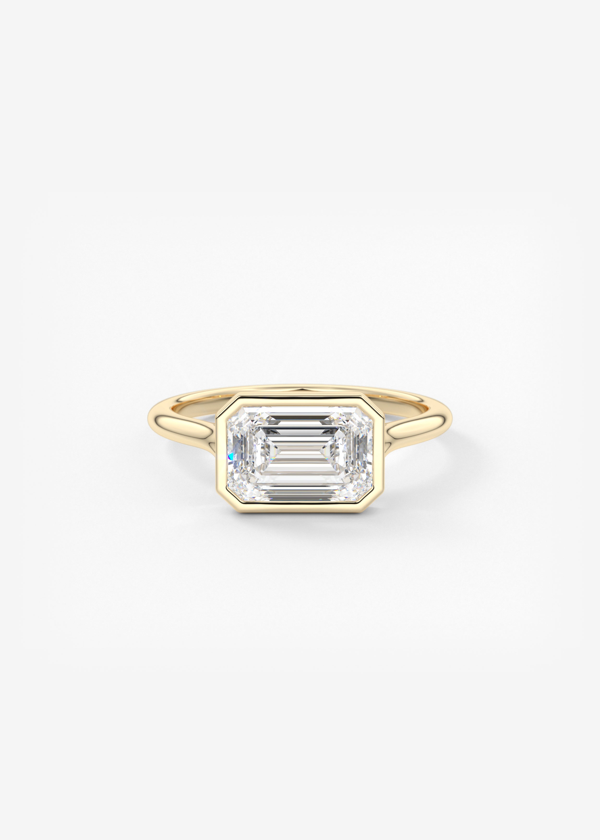 Breezy Bezel E.W.  engagement in YG metal featuring Emerald,Radiant cut with Solitaire,Bezel setting