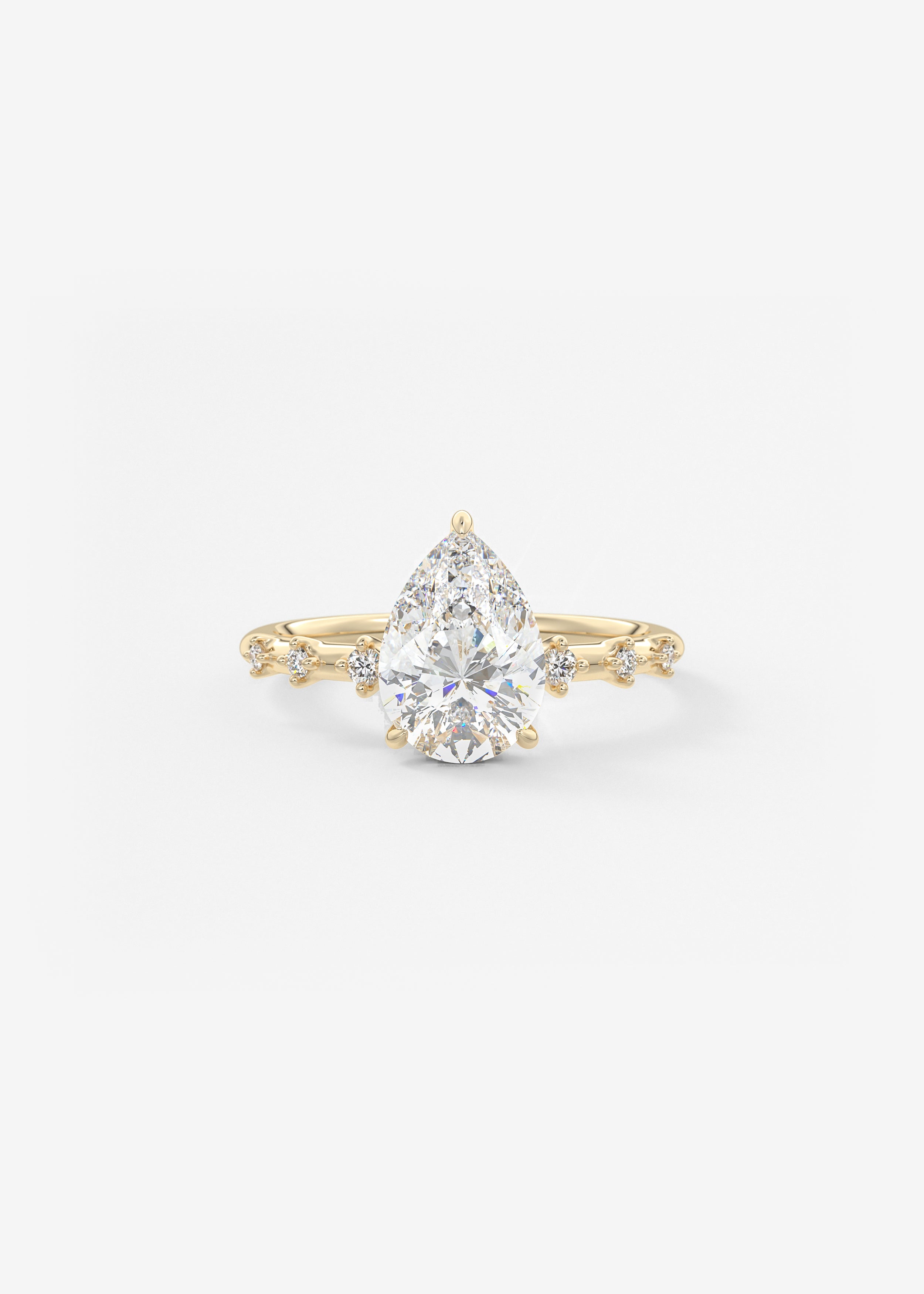 The Starlette engagement in YG metal featuring Pear cut with Prong,Diamond Details setting