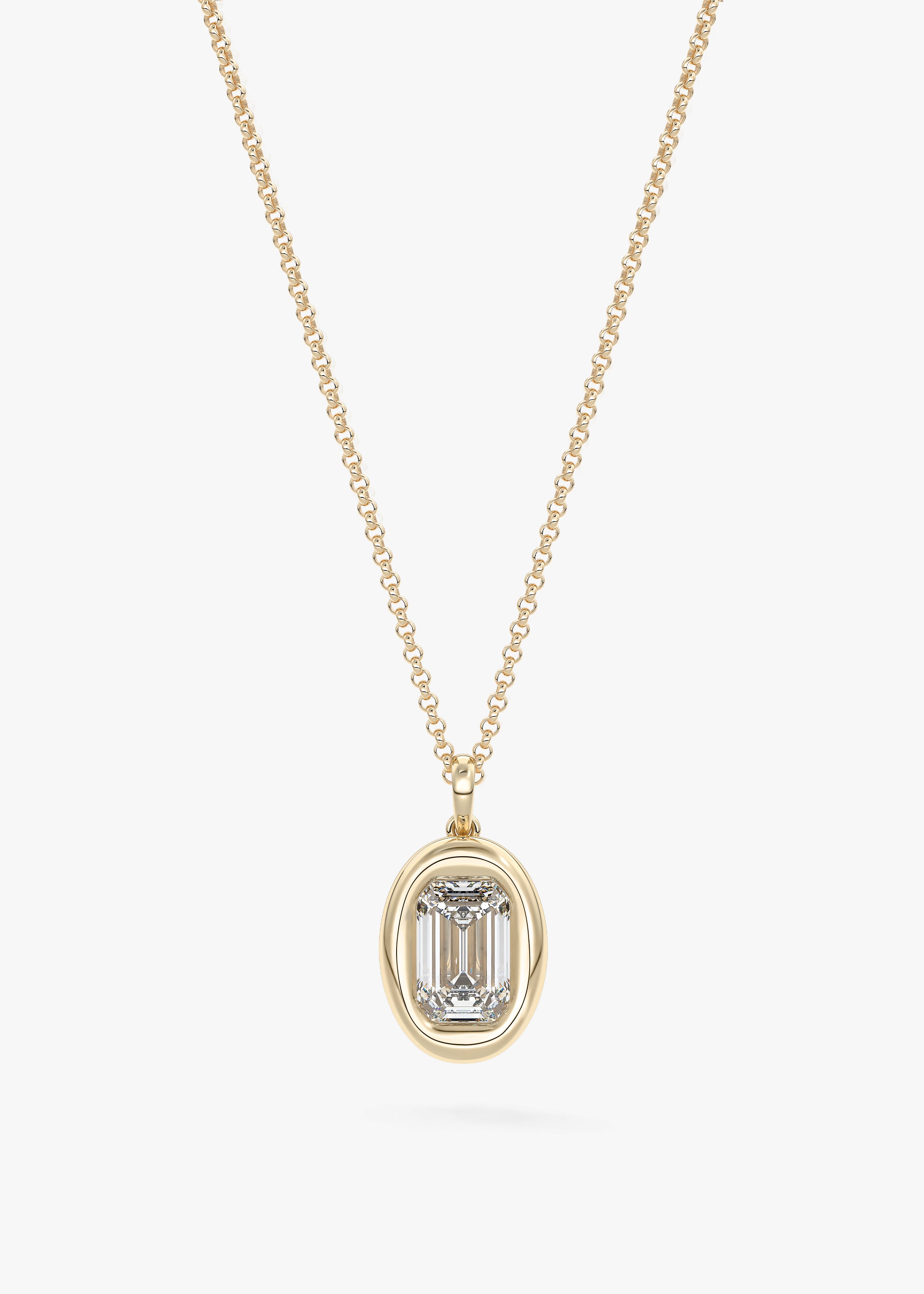 The Gumdrop necklace in YG metal featuring Emerald cut with Bezel,Emerald setting
