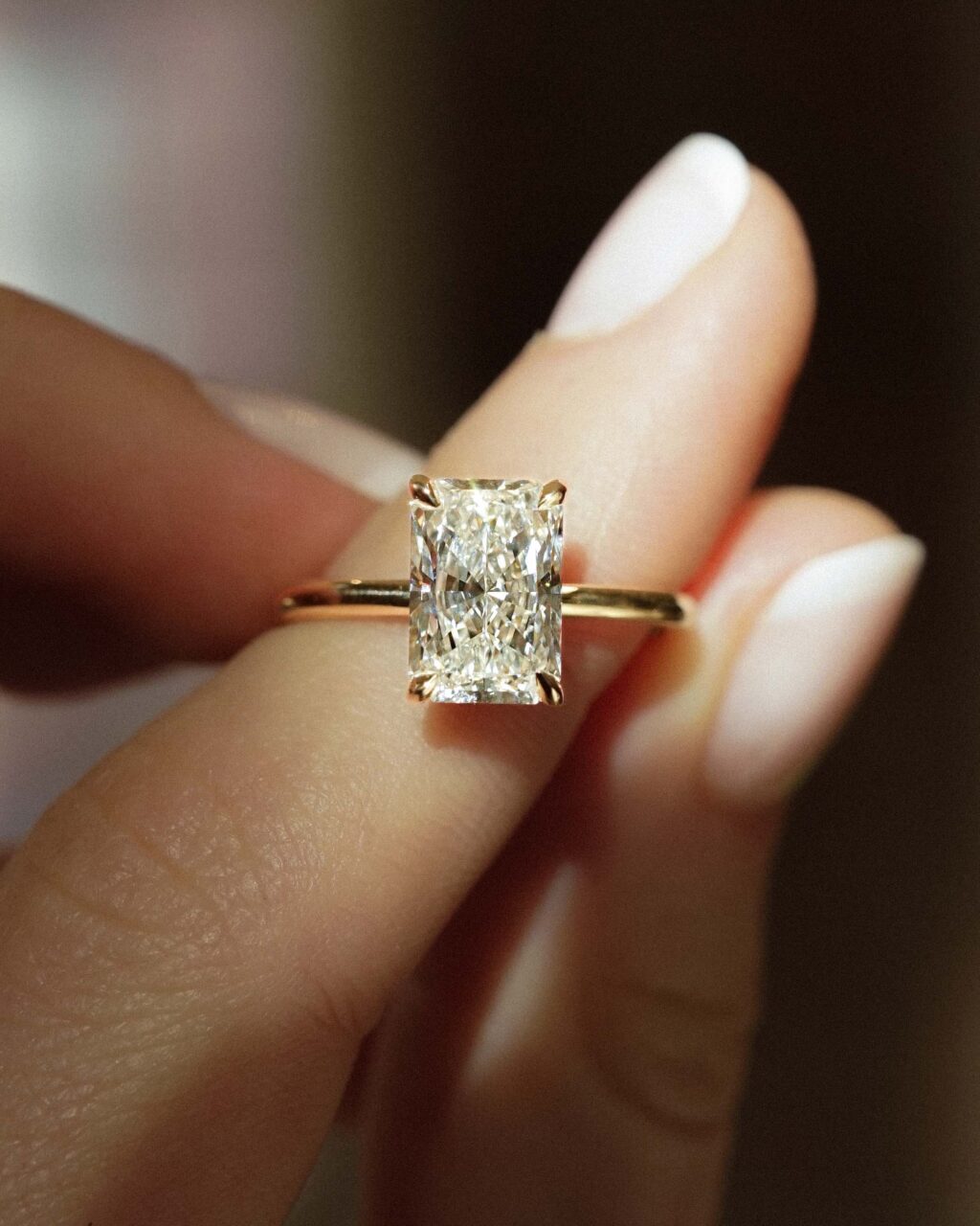 A radiant cut diamond with claw prongs 