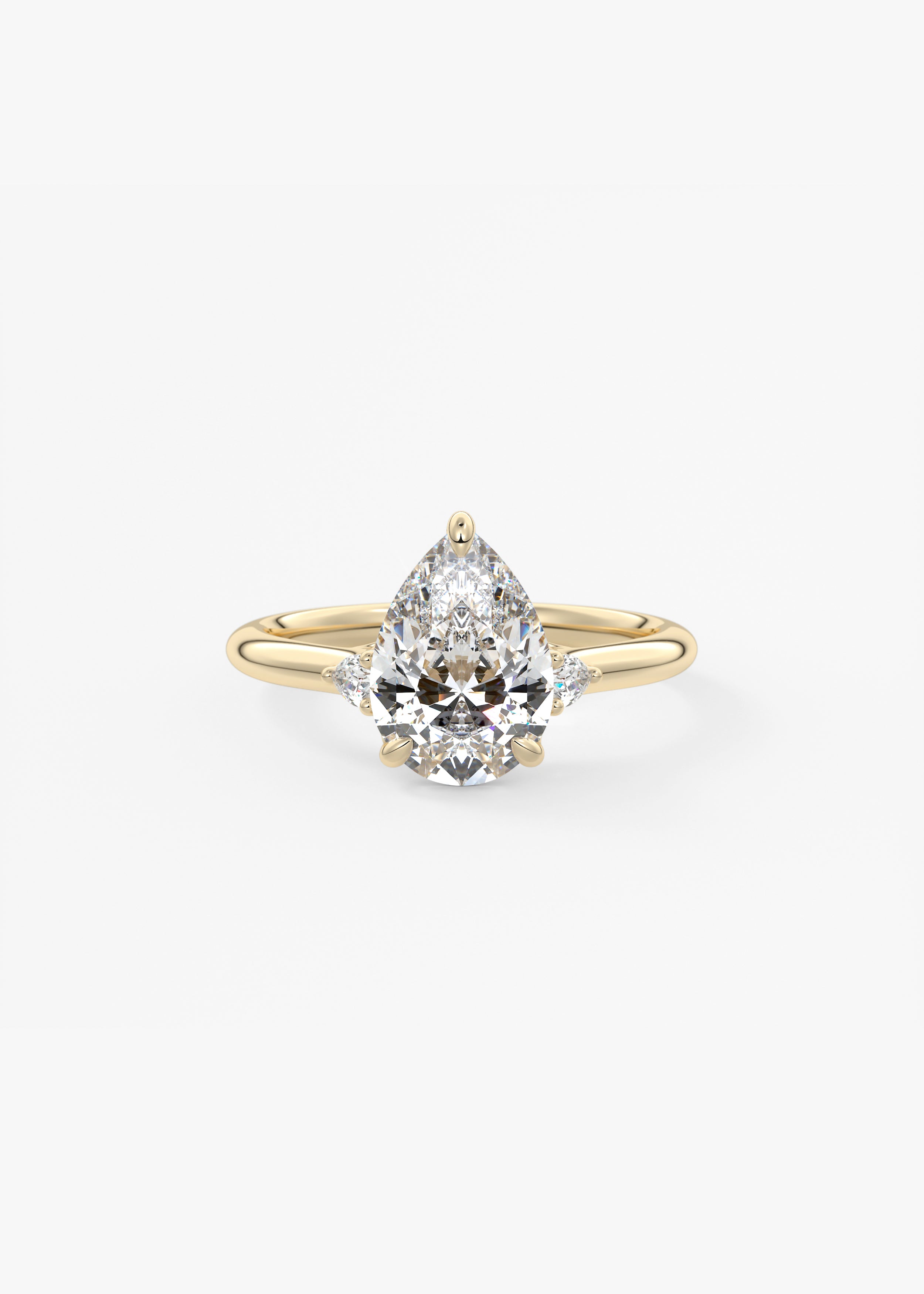 The Arbor Three Stone engagement in YG metal featuring Pear cut with Three Stone,Prong,Nature Inspired setting