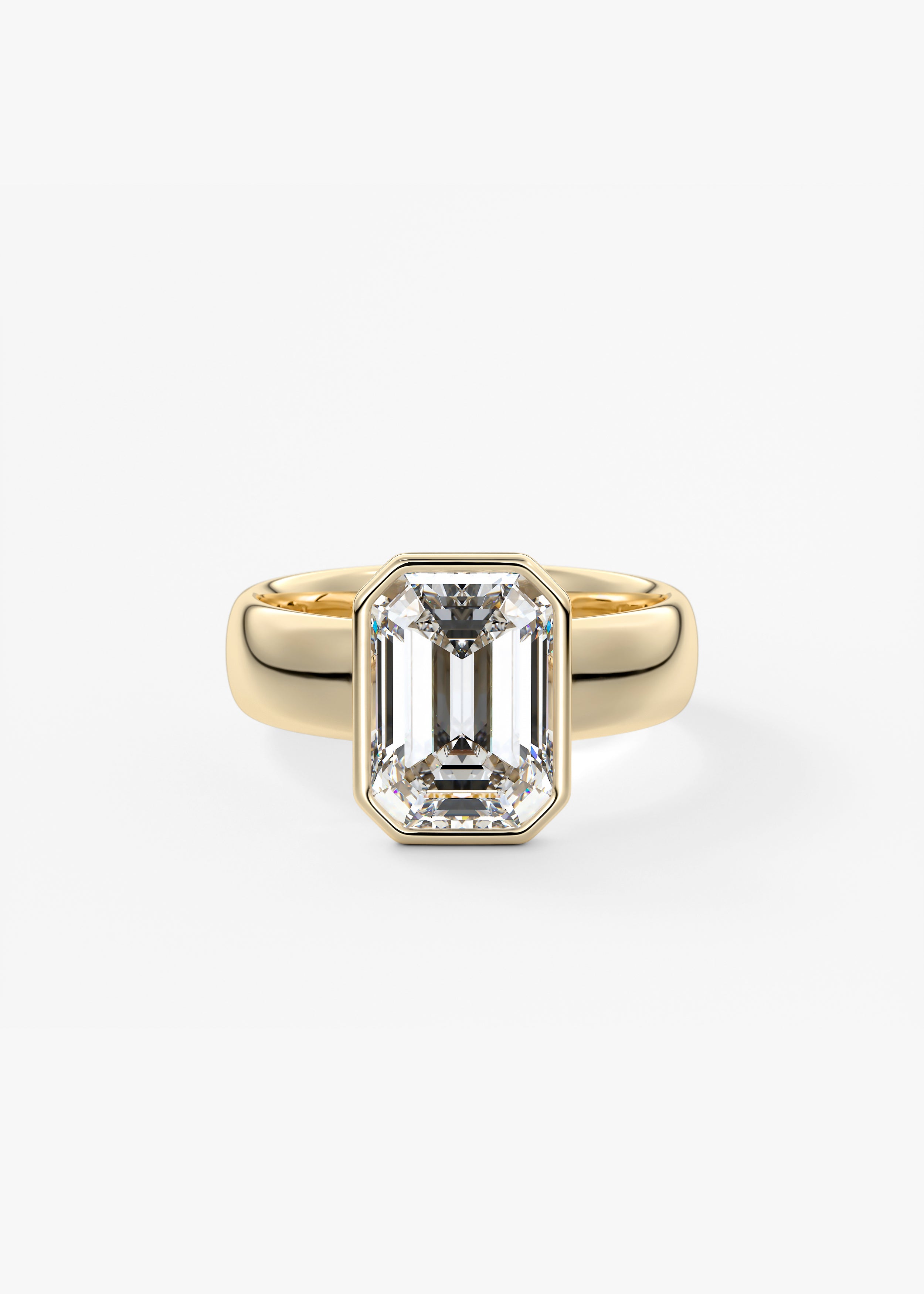 The Daily Bezel XL  engagement in YG metal featuring Emerald cut with Solitaire,Bezel setting