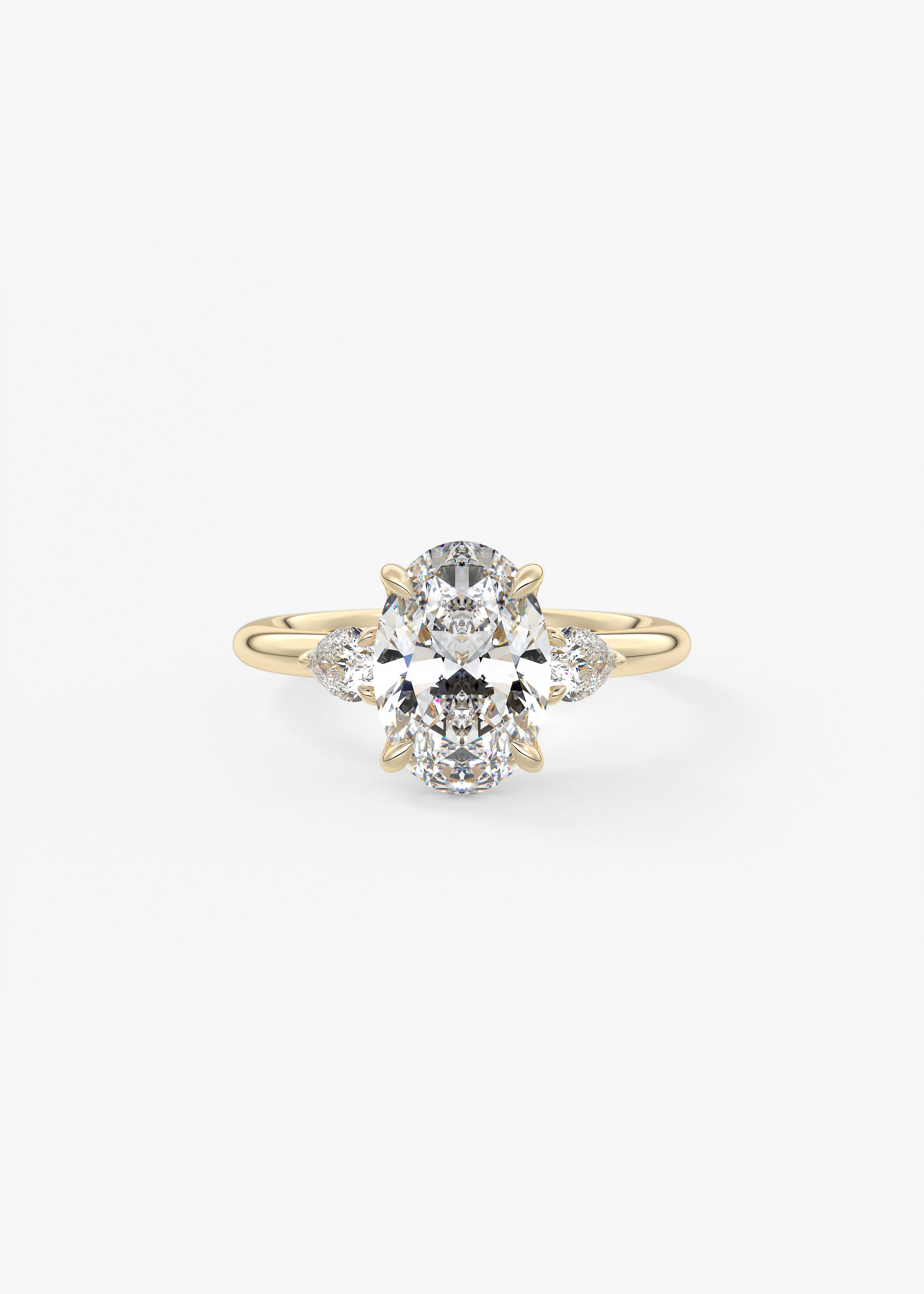 Royale Three Stone engagement in YG metal featuring Oval cut with Three Stone,Prong setting