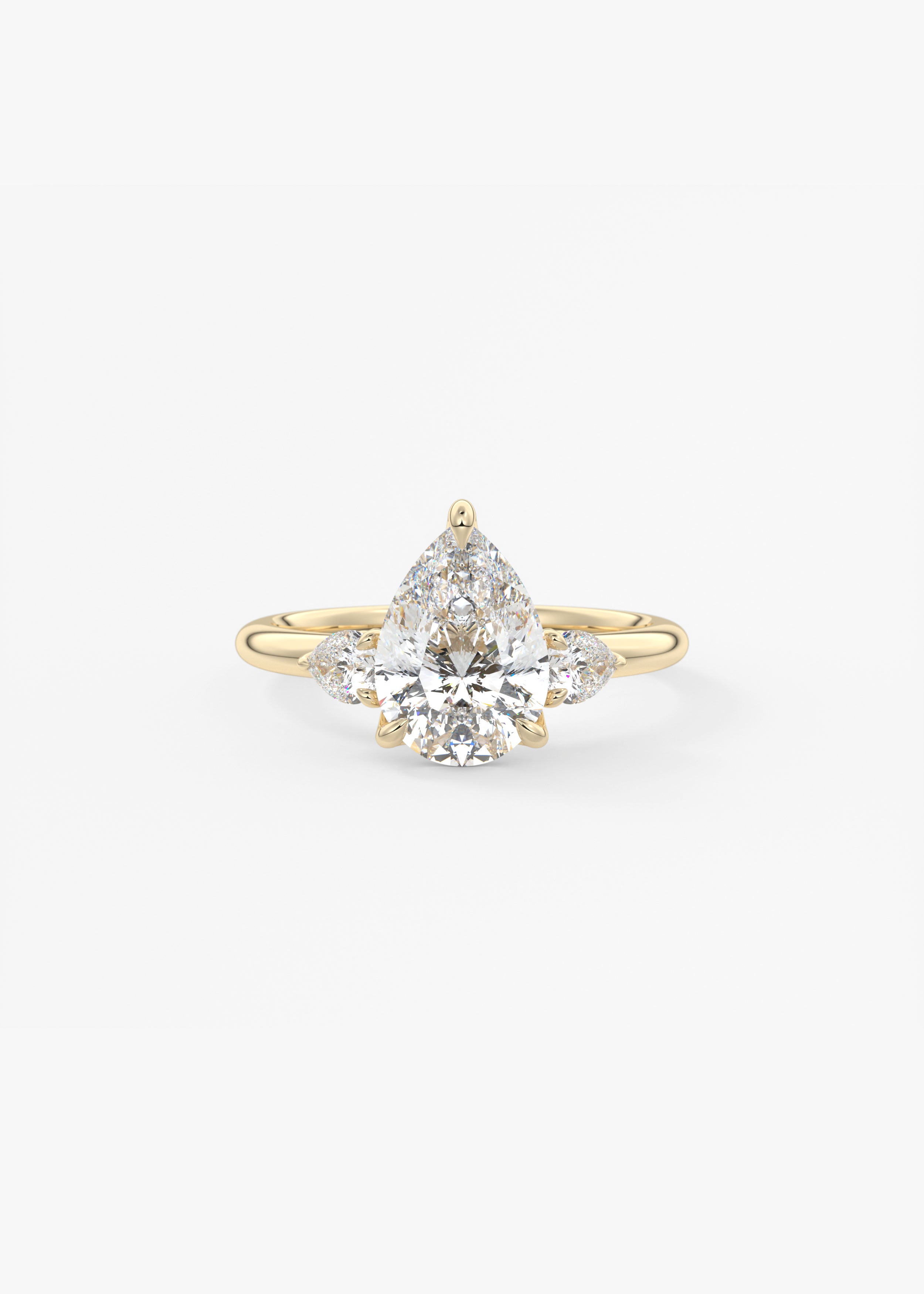 Royale Three Stone  engagement in YG metal featuring Pear cut with Three Stone,Prong setting