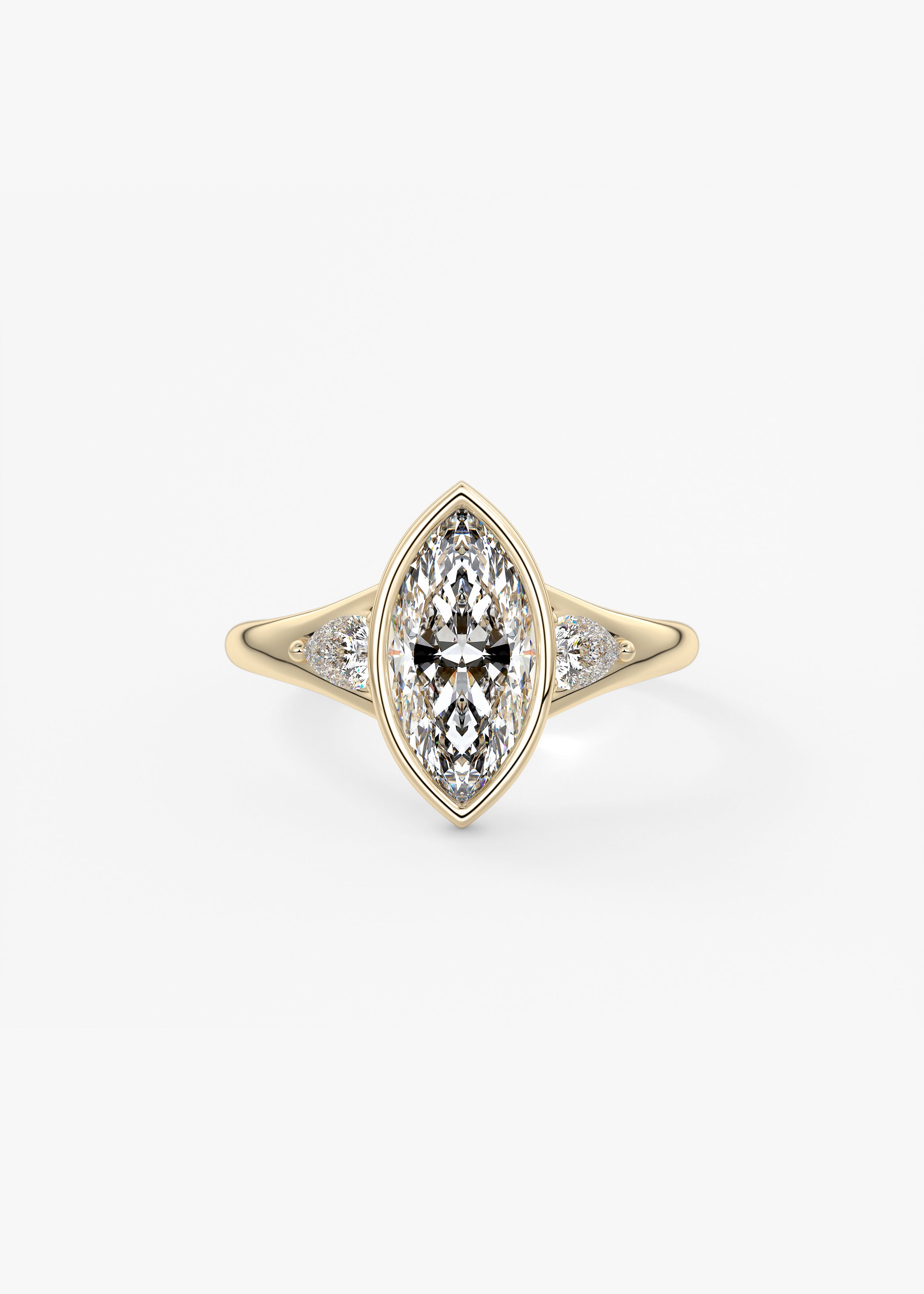 The Symphony Bezel engagement in YG metal featuring Marquise cut with Three Stone,Bezel,Cluster,Split Shank setting