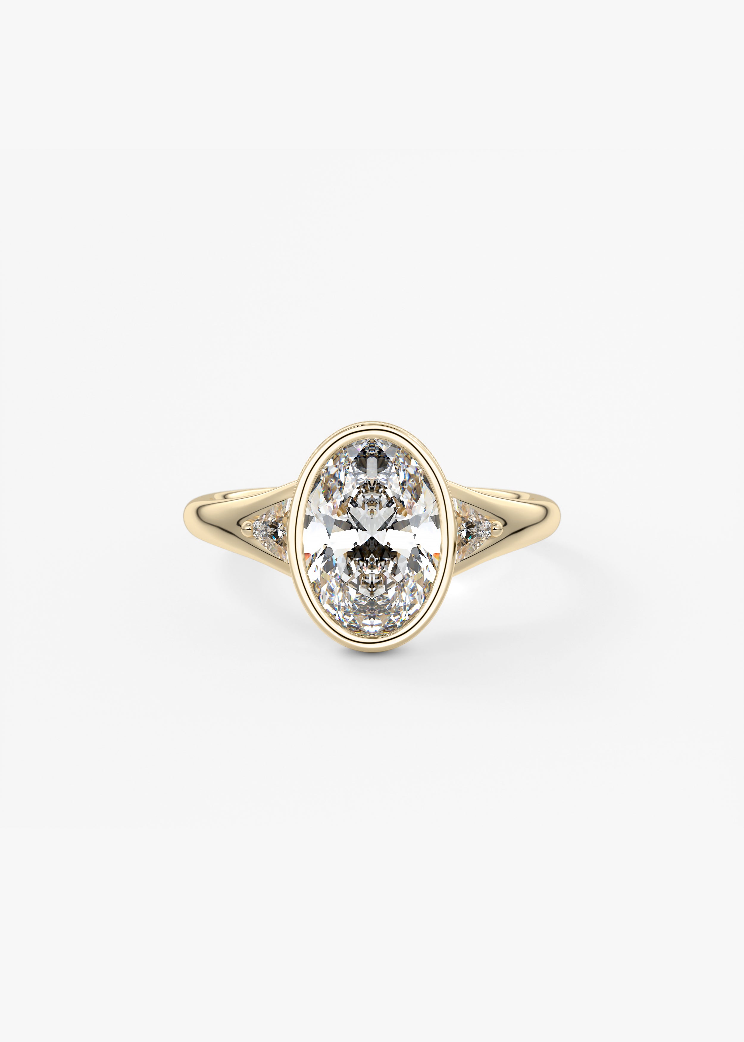 The Symphony Bezel engagement in YG metal featuring Oval cut with Three Stone,Bezel,Cluster,Split Shank setting
