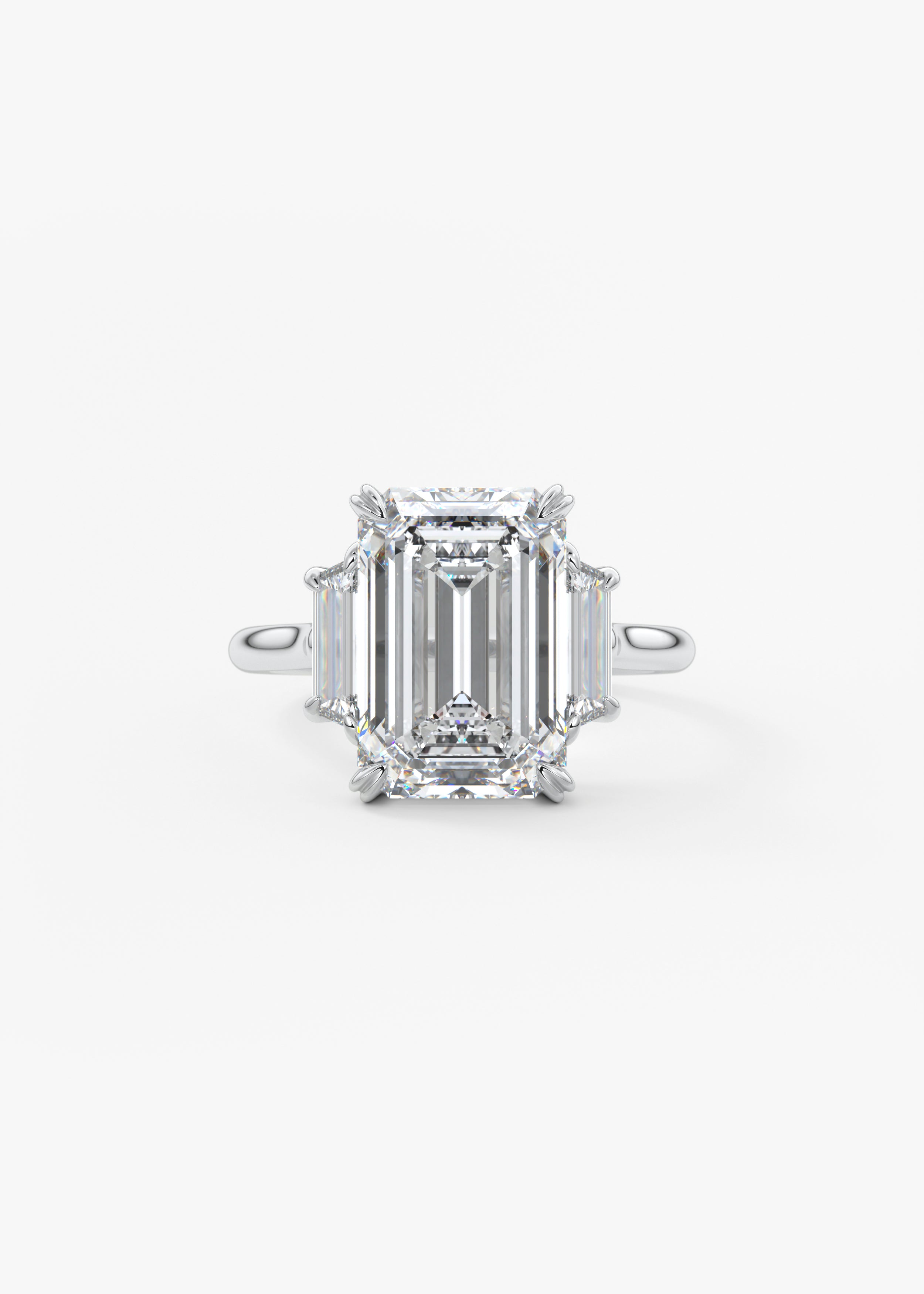 The 幸运在线168官方飞艇结果体彩查询网 Marguerite engagement in WG metal featuring Emerald cut with Prong, three_stone setting
