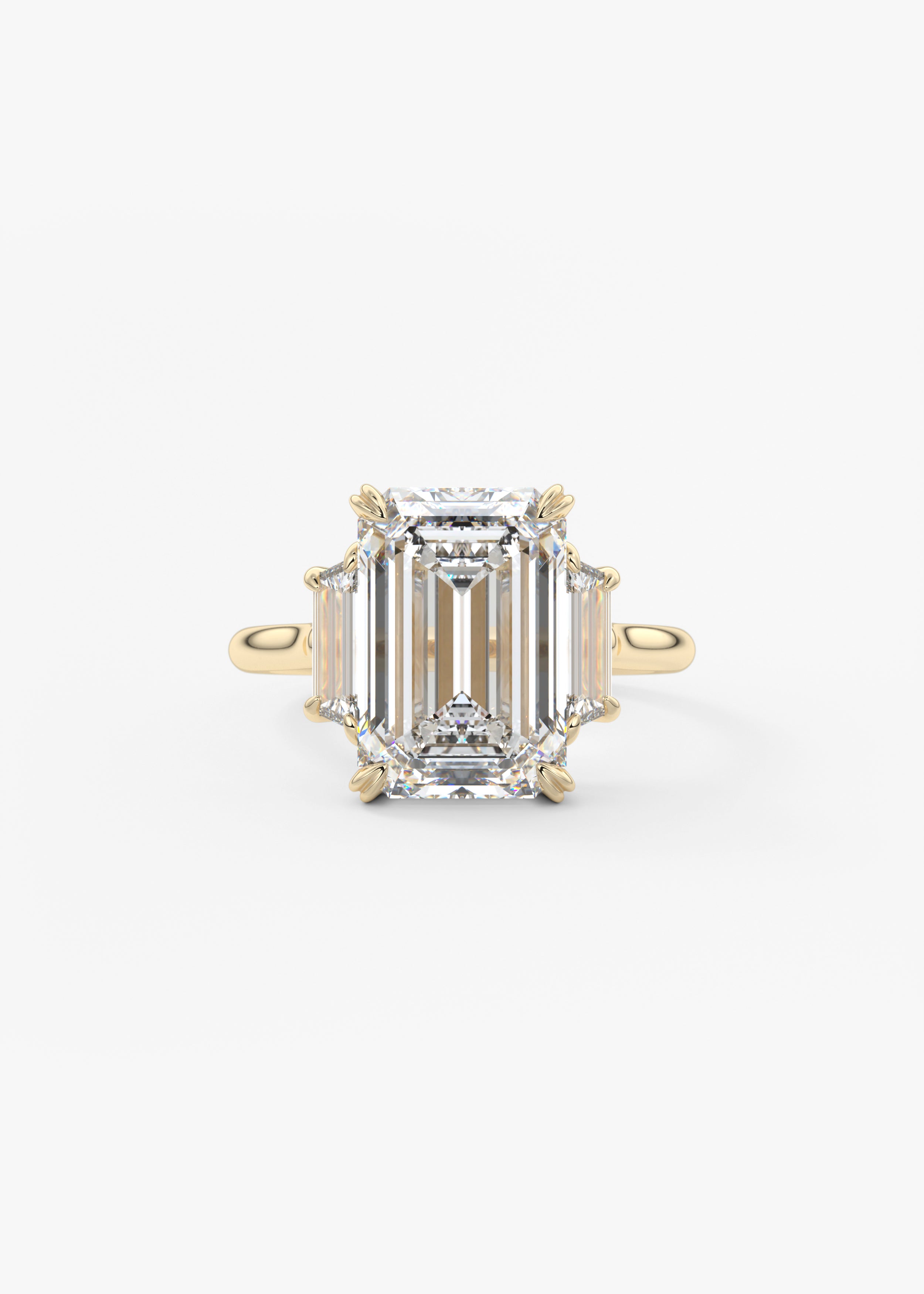 The Marguerite  engagement in YG metal featuring Emerald cut with Prong,Three Stone setting