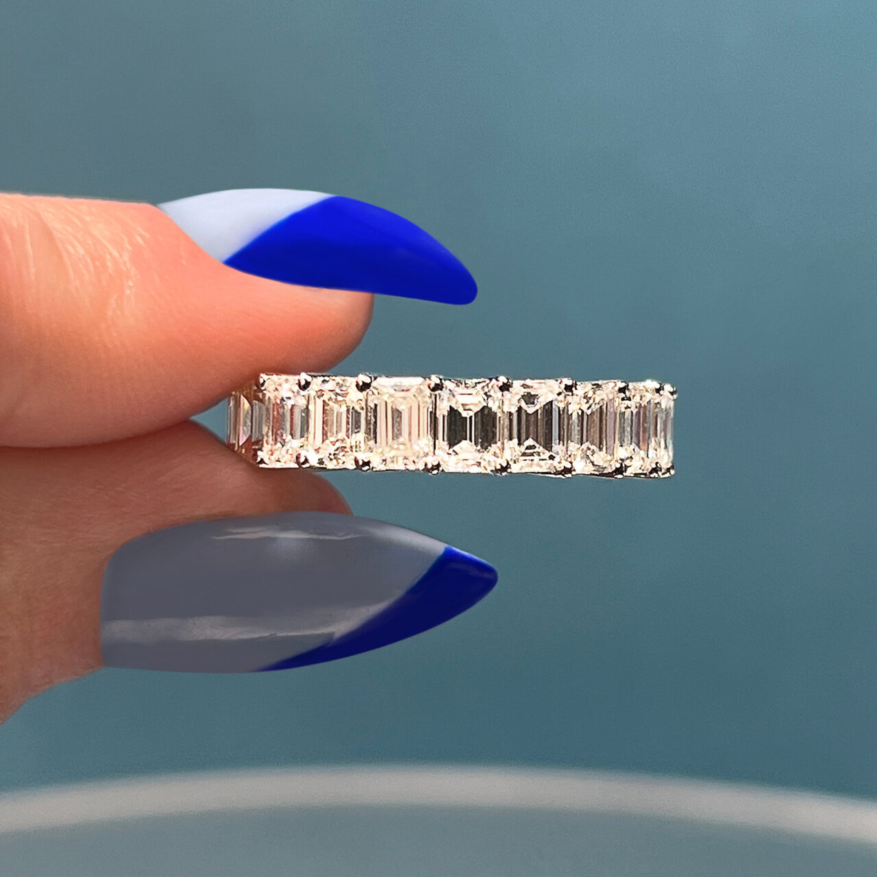 custom east west emerald eternity band
