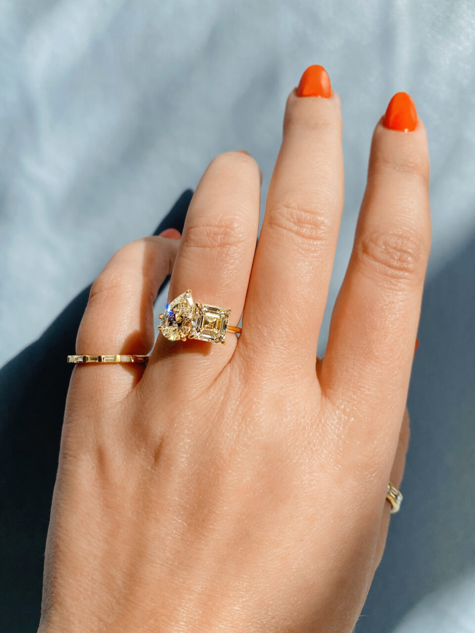 pear and asscher yellow gold toi et moi on hand
