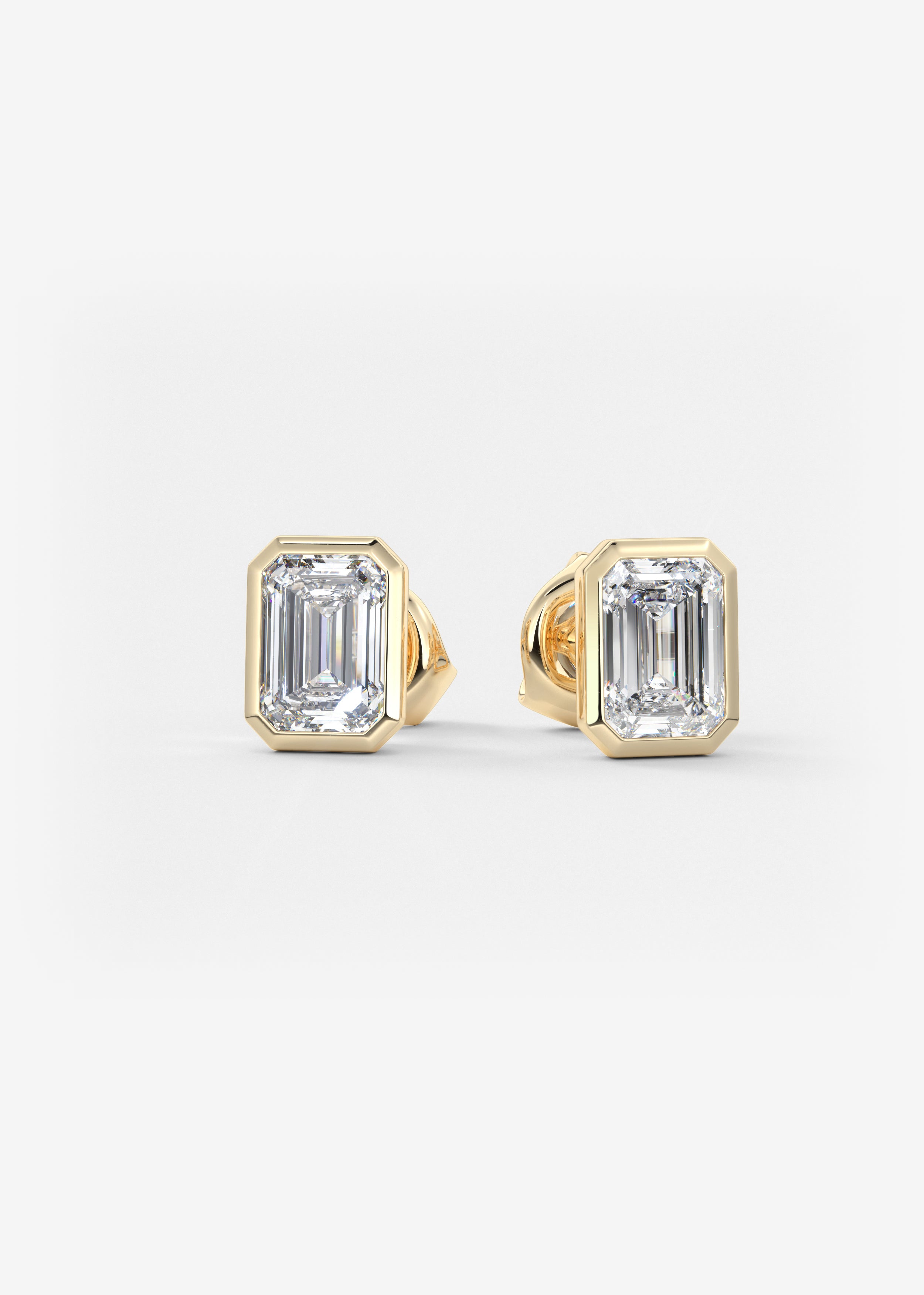 The Lowrider  stud in YG metal featuring Emerald cut with Bezel,Solitaire setting