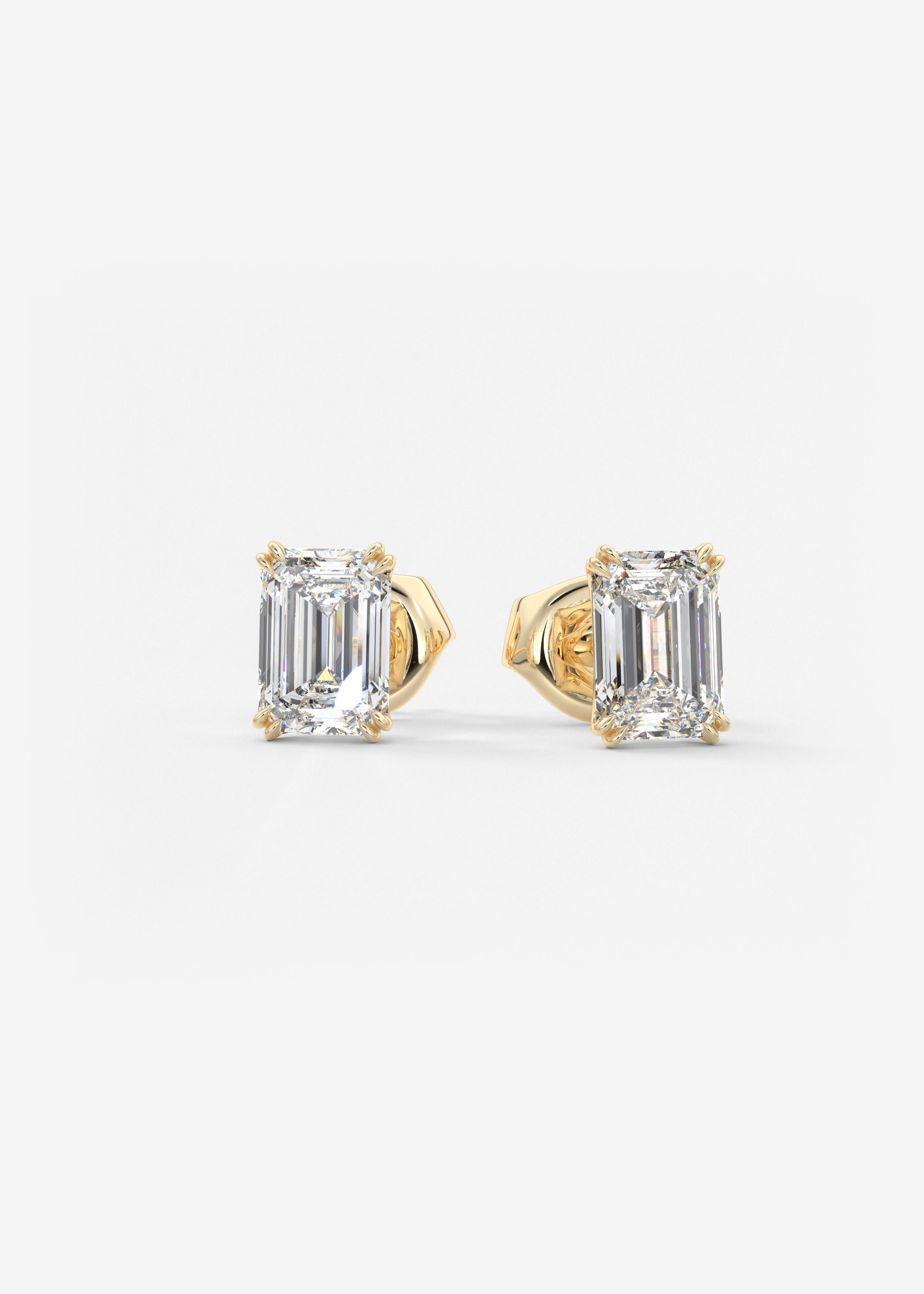 Double Scoop  stud in YG metal featuring Emerald cut with Prong,Solitaire setting